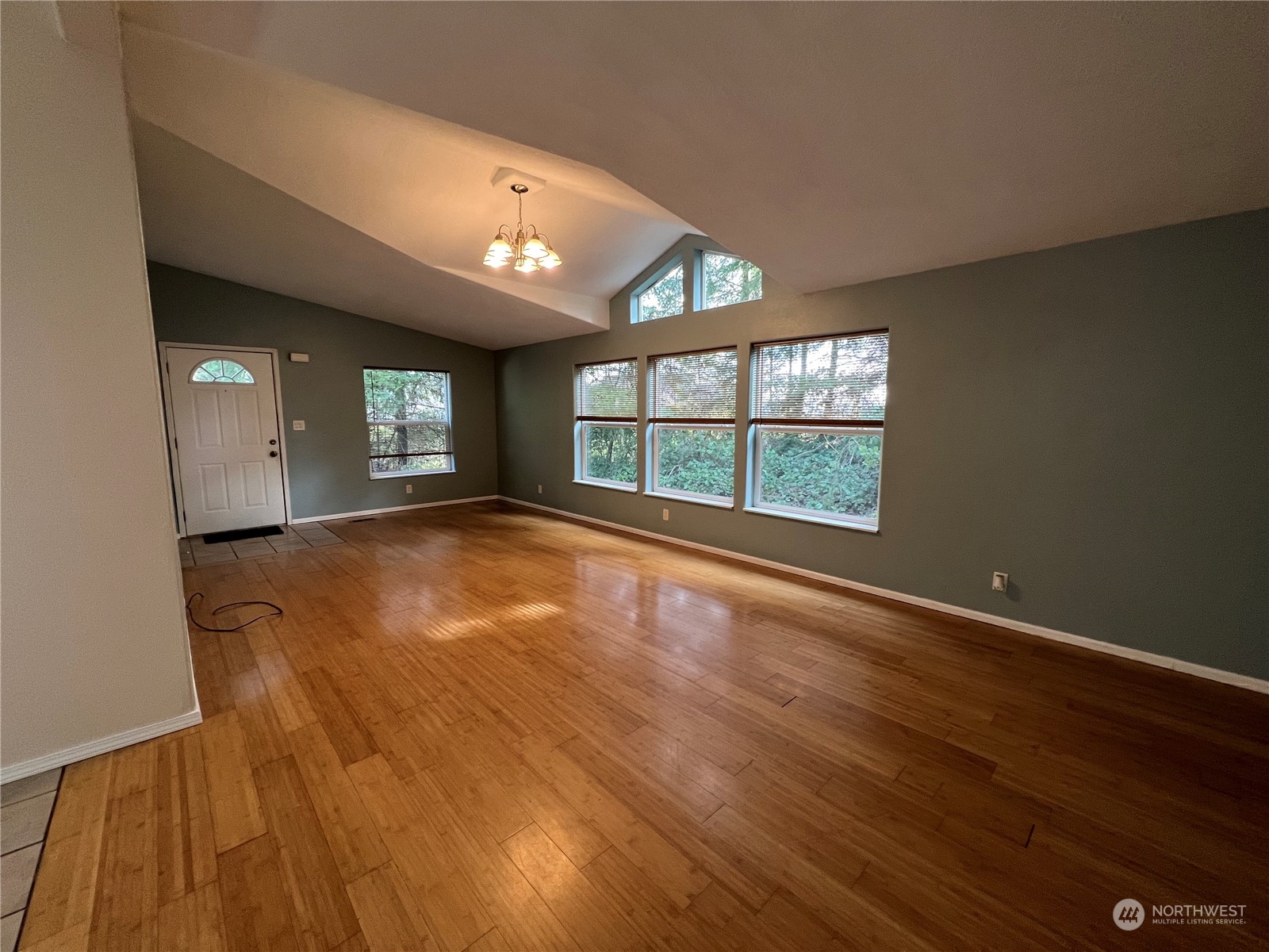 827 Cousins Road, Unit 27 Chehalis, WA 98532 - Photo 9 of 38 wooden floor in an empty room with a window