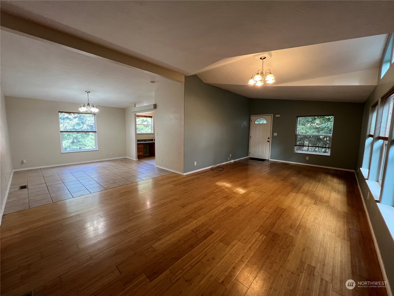 827 Cousins Road, Unit 27 Chehalis, WA 98532 - Photo 10 of 38 an empty room with wooden floor and windows