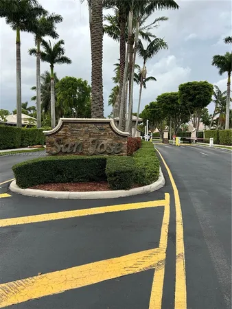 a view of a yard with palm trees