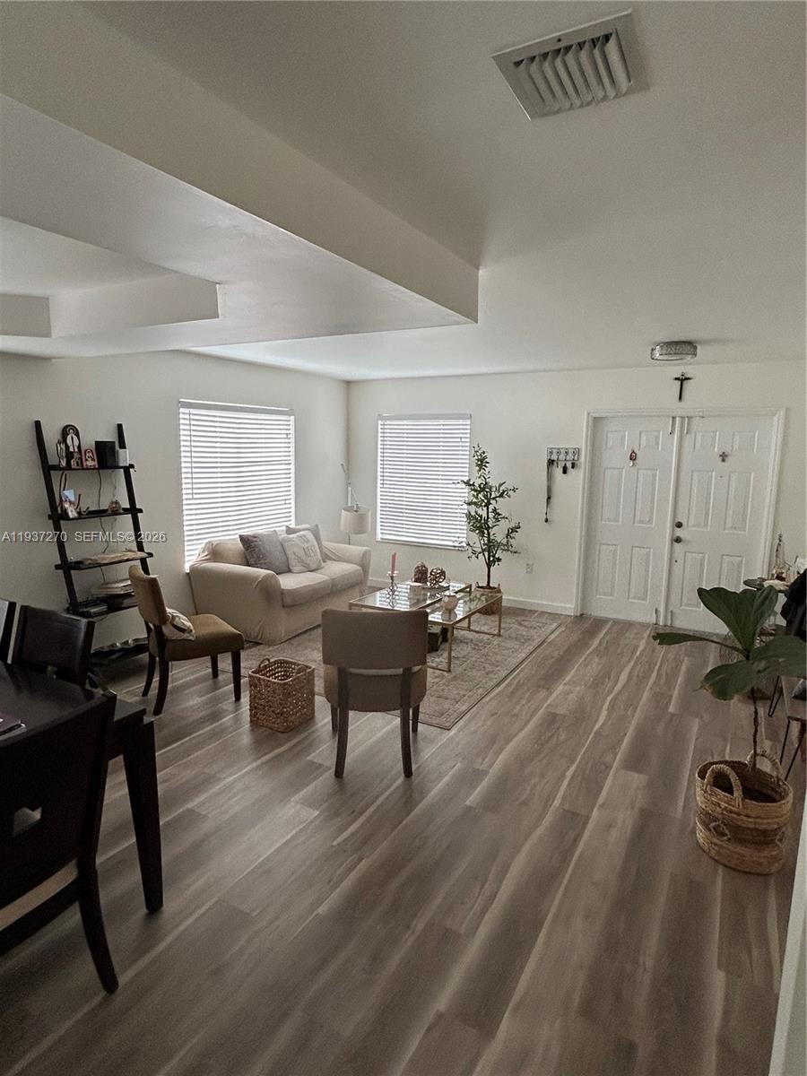 15442 Southwest 139th Street Miami, FL 33196 - Photo 12 of 27 a living room with furniture and wooden floor