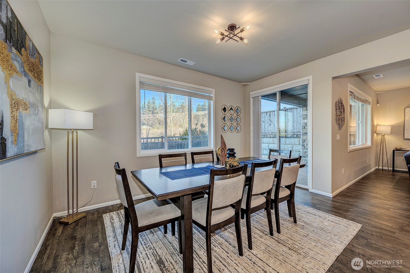 28902 239th Avenue Southeast Maple Valley, WA 98010 - Photo 11 of 36 a view of a dining room with furniture and wooden floor