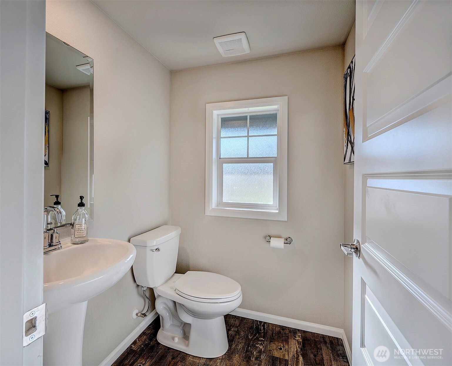 28902 239th Avenue Southeast Maple Valley, WA 98010 - Photo 18 of 36 a bathroom with a toilet sink and a mirror