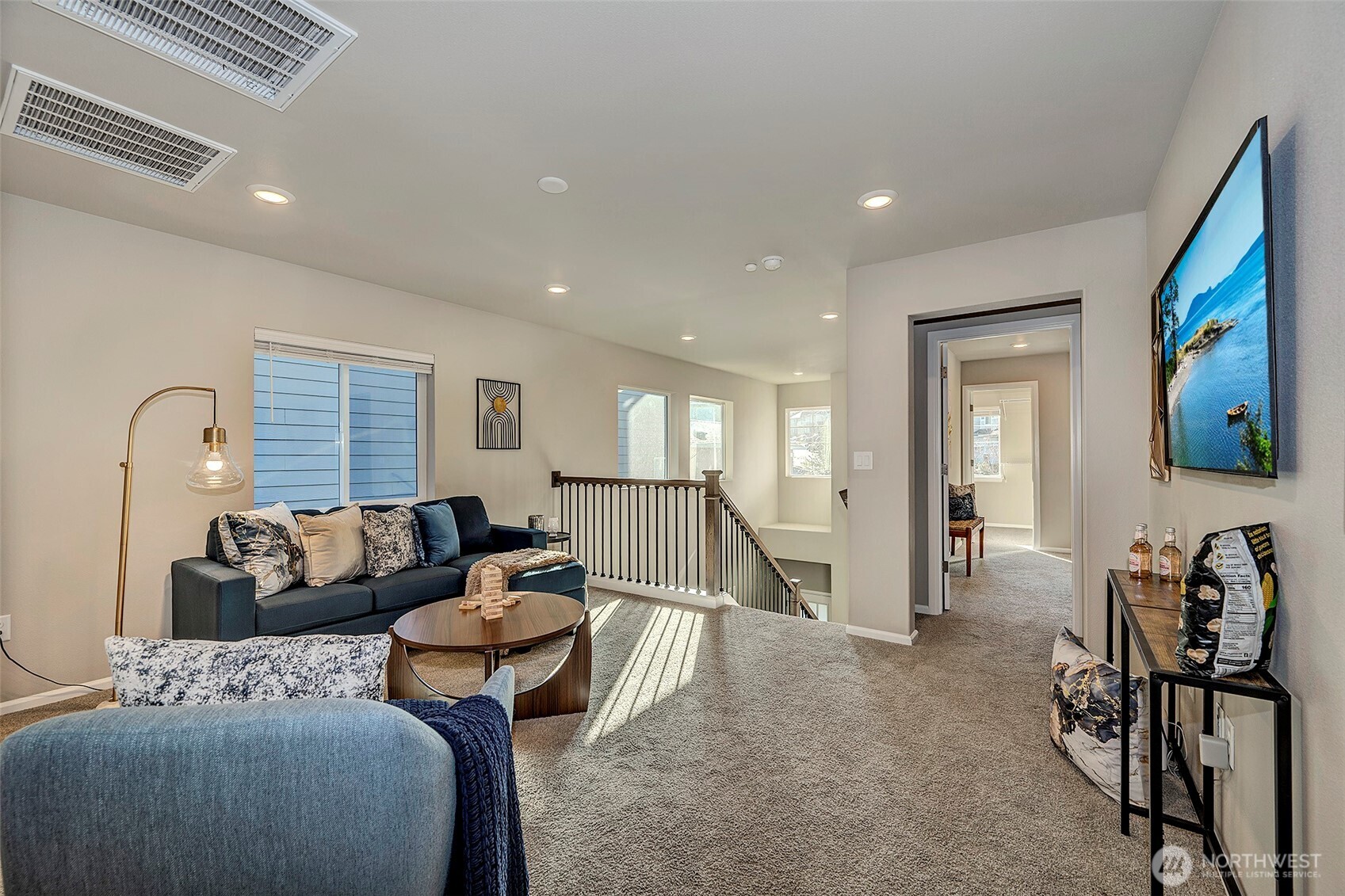 28902 239th Avenue Southeast Maple Valley, WA 98010 - Photo 20 of 36 a living room with furniture and a flat screen tv