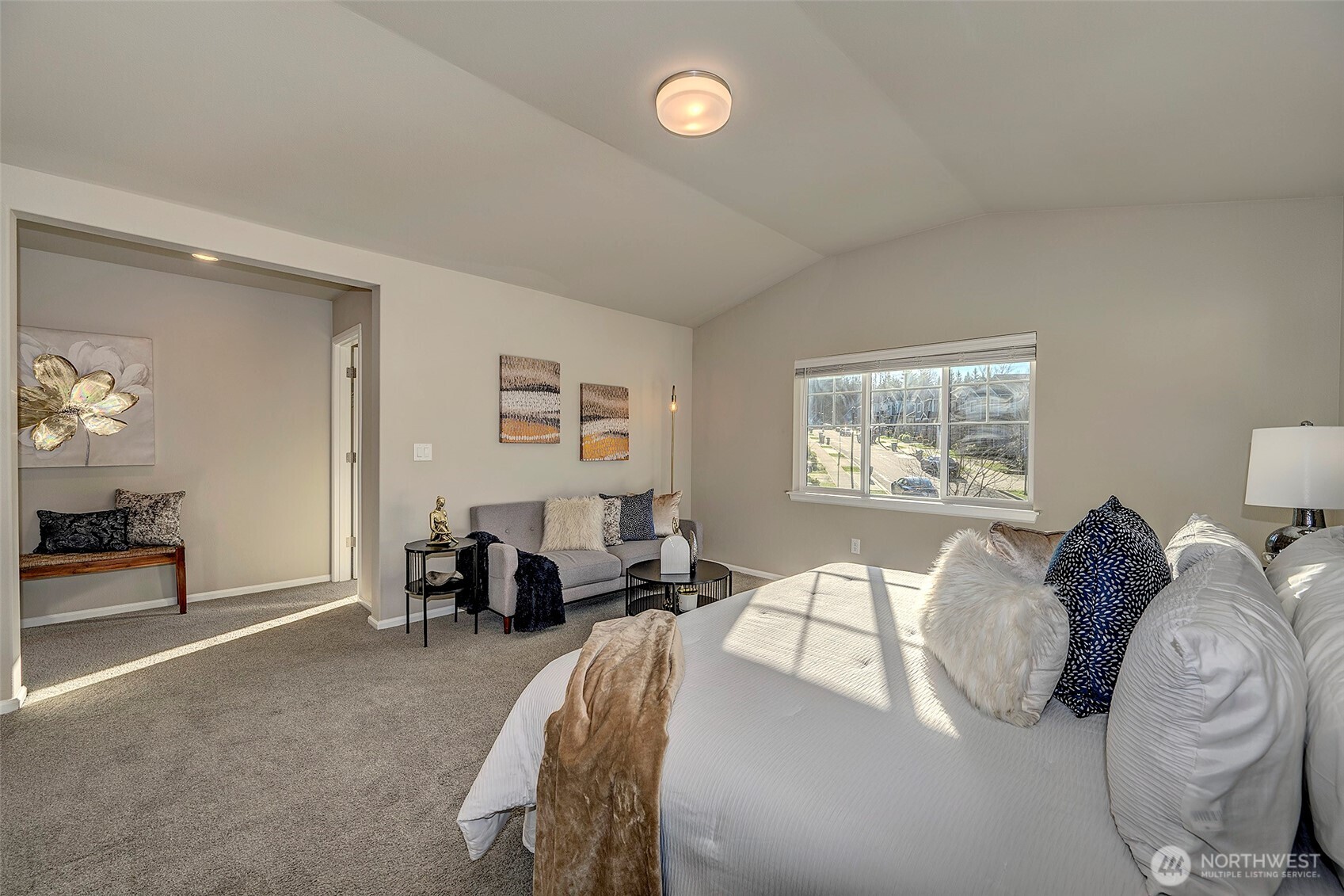 28902 239th Avenue Southeast Maple Valley, WA 98010 - Photo 23 of 36 a spacious bedroom with a bed and a table in it