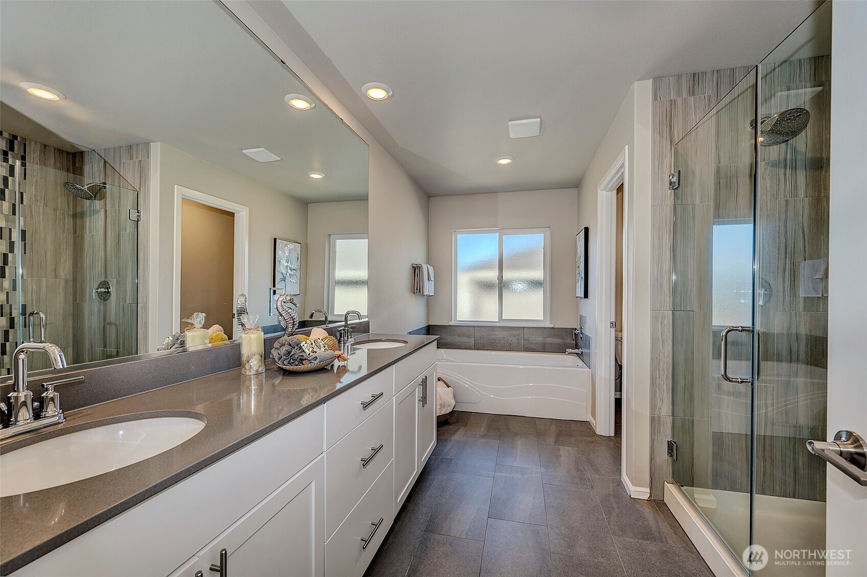 28902 239th Avenue Southeast Maple Valley, WA 98010 - Photo 24 of 36 a bathroom with a double vanity sink and mirror with shower