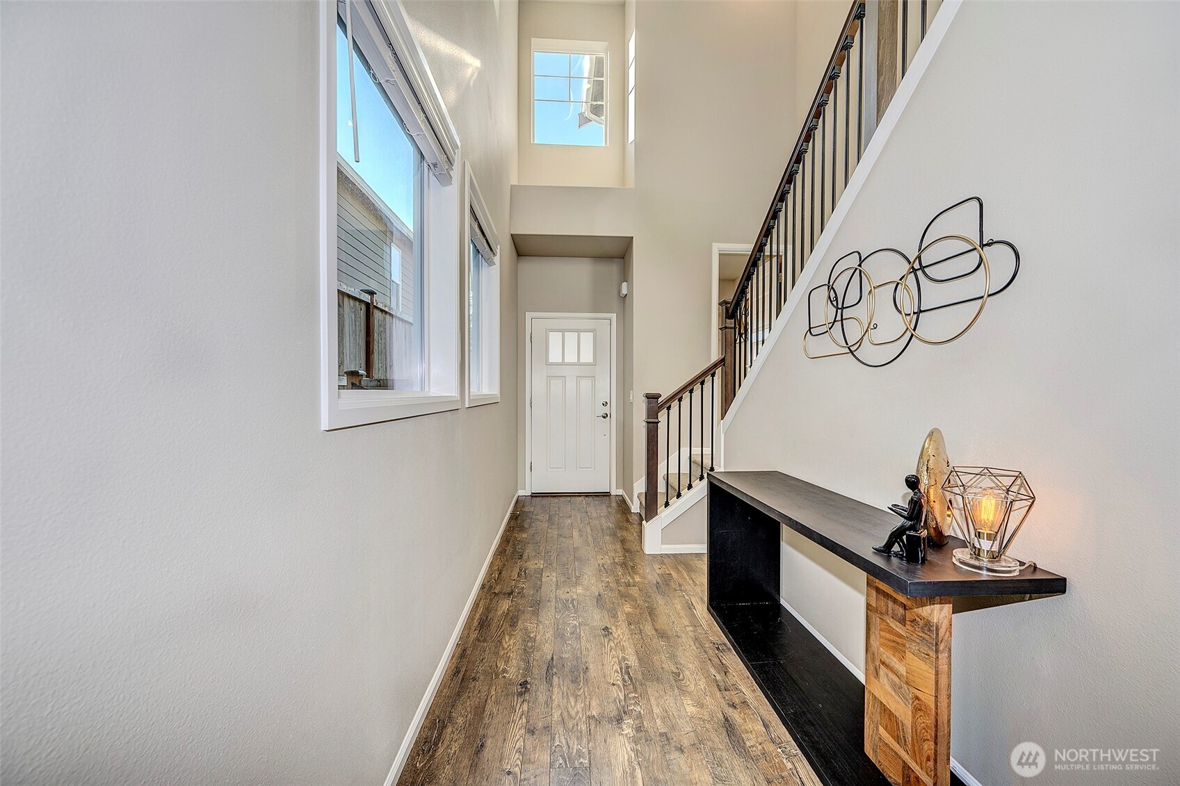 28902 239th Avenue Southeast Maple Valley, WA 98010 - Photo 5 of 36 a view of entryway and hall with wooden floor