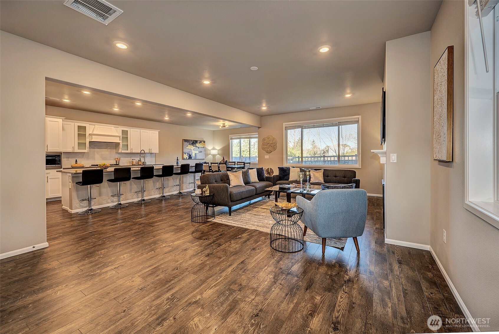 28902 239th Avenue Southeast Maple Valley, WA 98010 - Photo 6 of 36 a living room with furniture kitchen view and a wooden floor