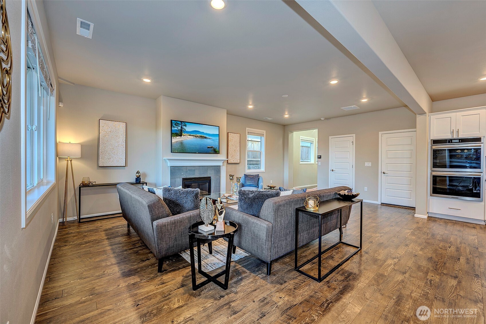 28902 239th Avenue Southeast Maple Valley, WA 98010 - Photo 8 of 36 a living room with furniture a fireplace and a flat screen tv