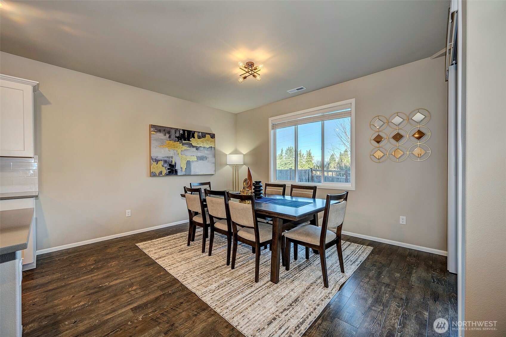 28902 239th Avenue Southeast Maple Valley, WA 98010 - Photo 10 of 36 a dining room with furniture a rug and a window