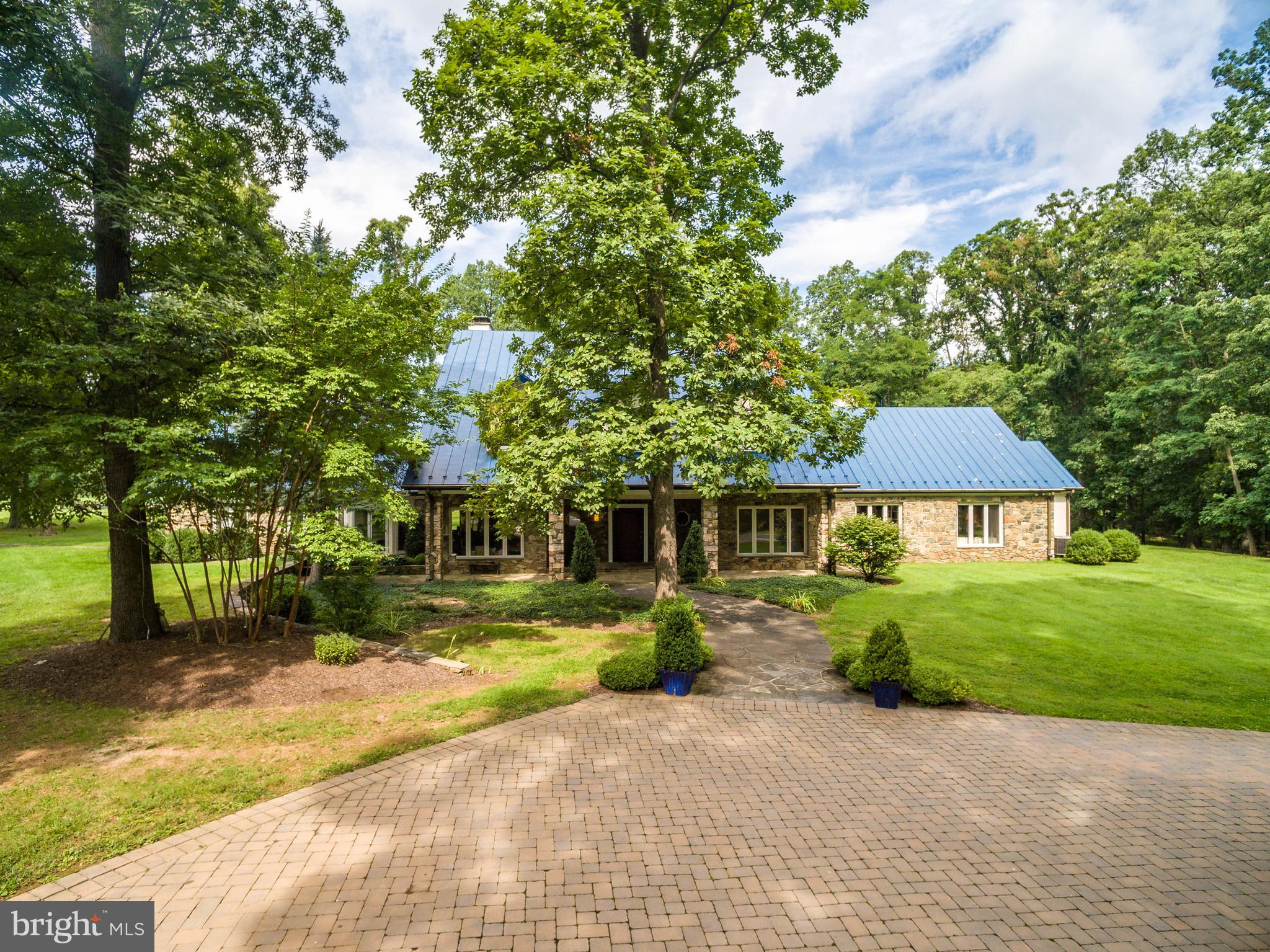 20022 Trappe Road Bluemont, VA 20135 - Photo 15 of 97 a front view of a house with a yard and trees