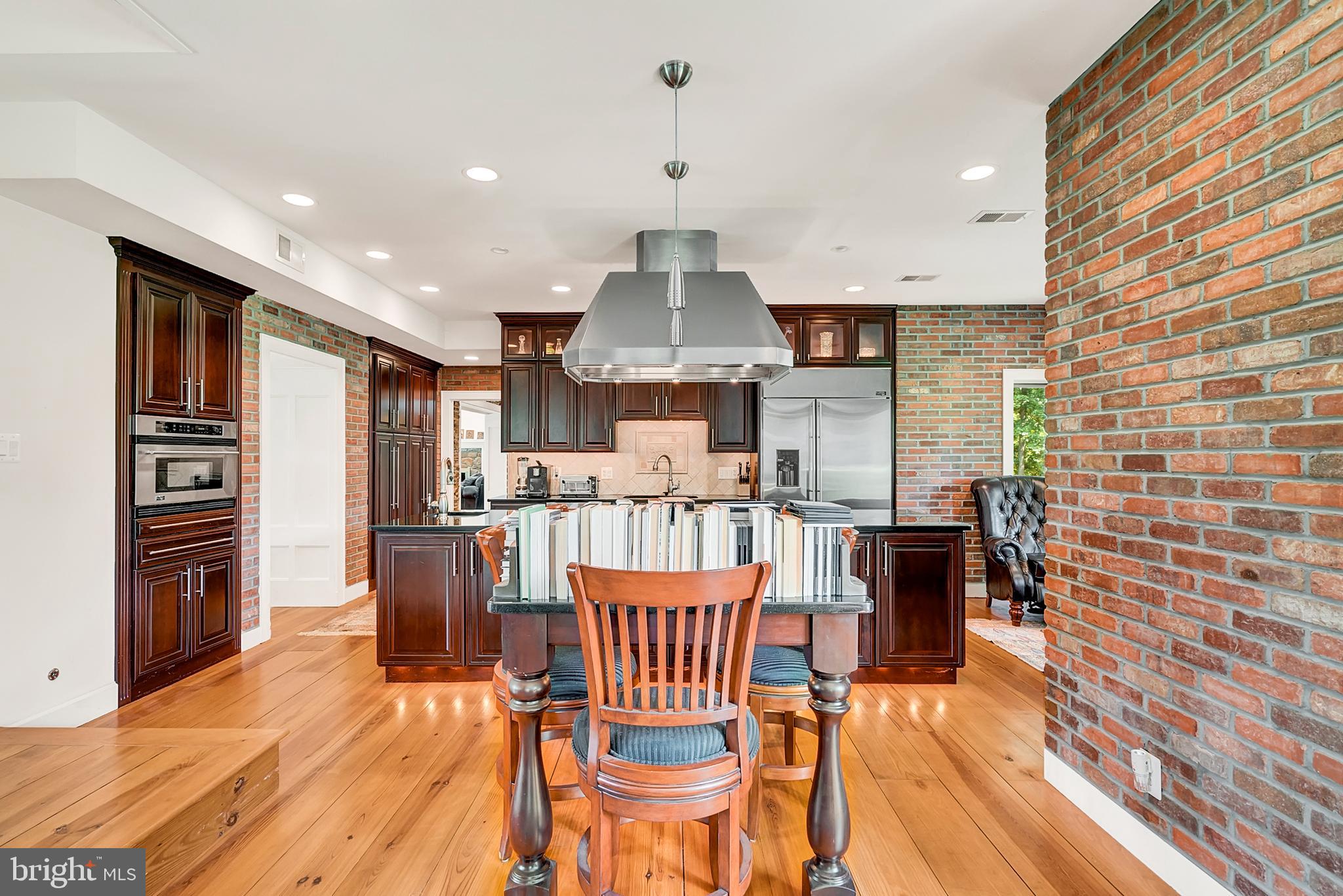 20022 Trappe Road Bluemont, VA 20135 - Photo 28 of 97 a view of a dining room with furniture a chandelier and wooden floor