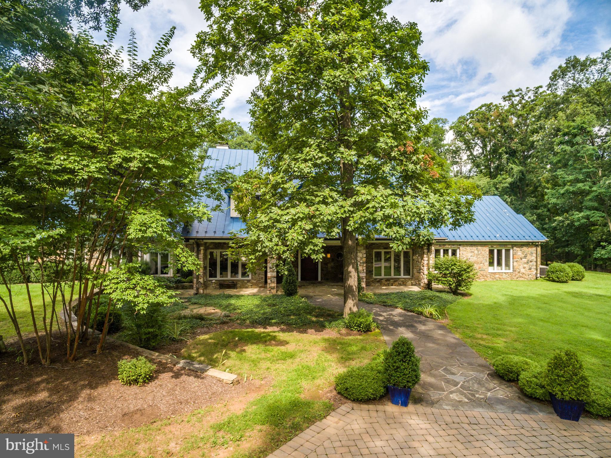 20022 Trappe Road Bluemont, VA 20135 - Photo 52 of 97 a front view of a house with a yard table and chairs