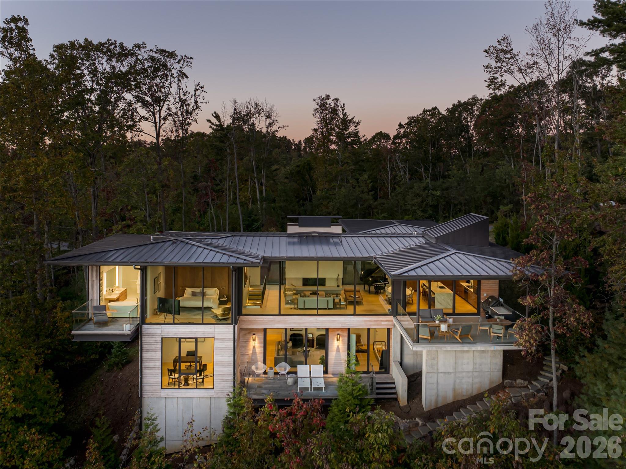 353 Retreat Ridge Way Asheville, NC 28804 - Photo 1 of 48 a view of a large building with a garden and plants
