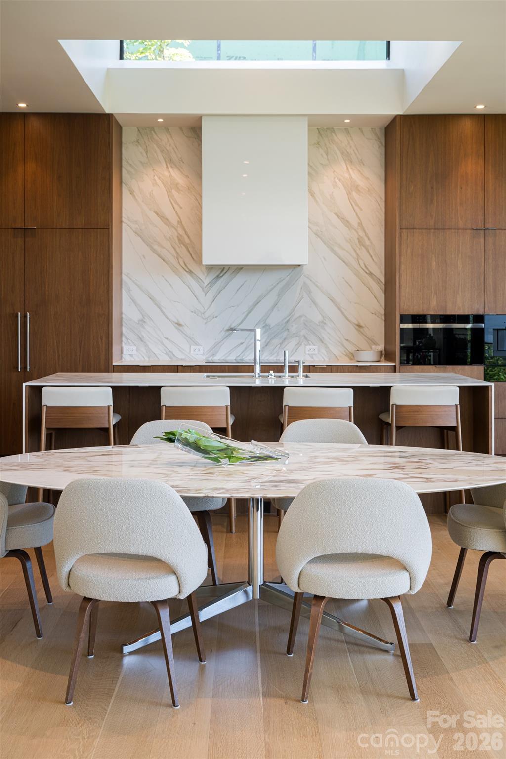 353 Retreat Ridge Way Asheville, NC 28804 - Photo 15 of 48 a kitchen with a dining table chairs and a stove