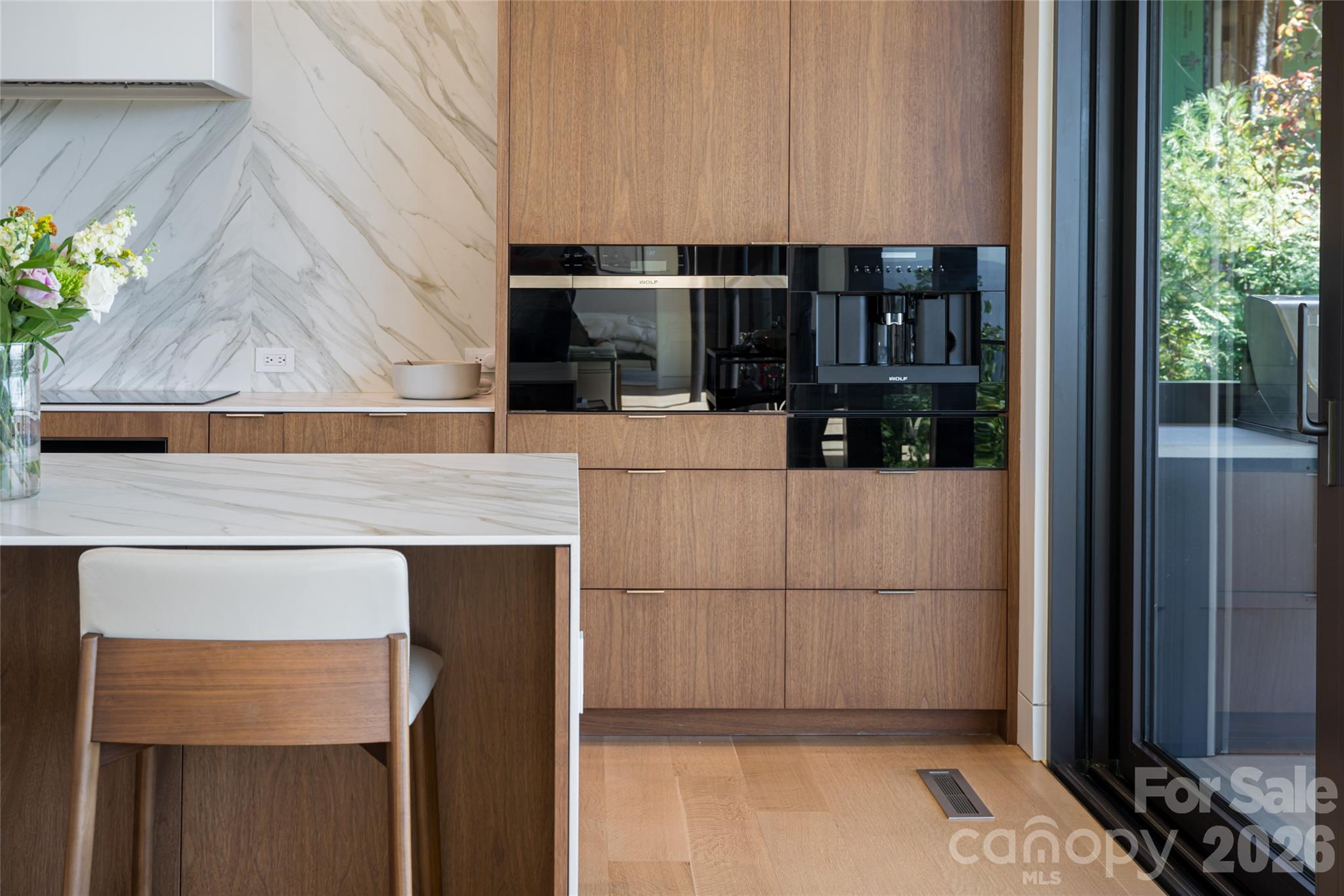 353 Retreat Ridge Way Asheville, NC 28804 - Photo 17 of 48 a kitchen with a sink a refrigerator and trees