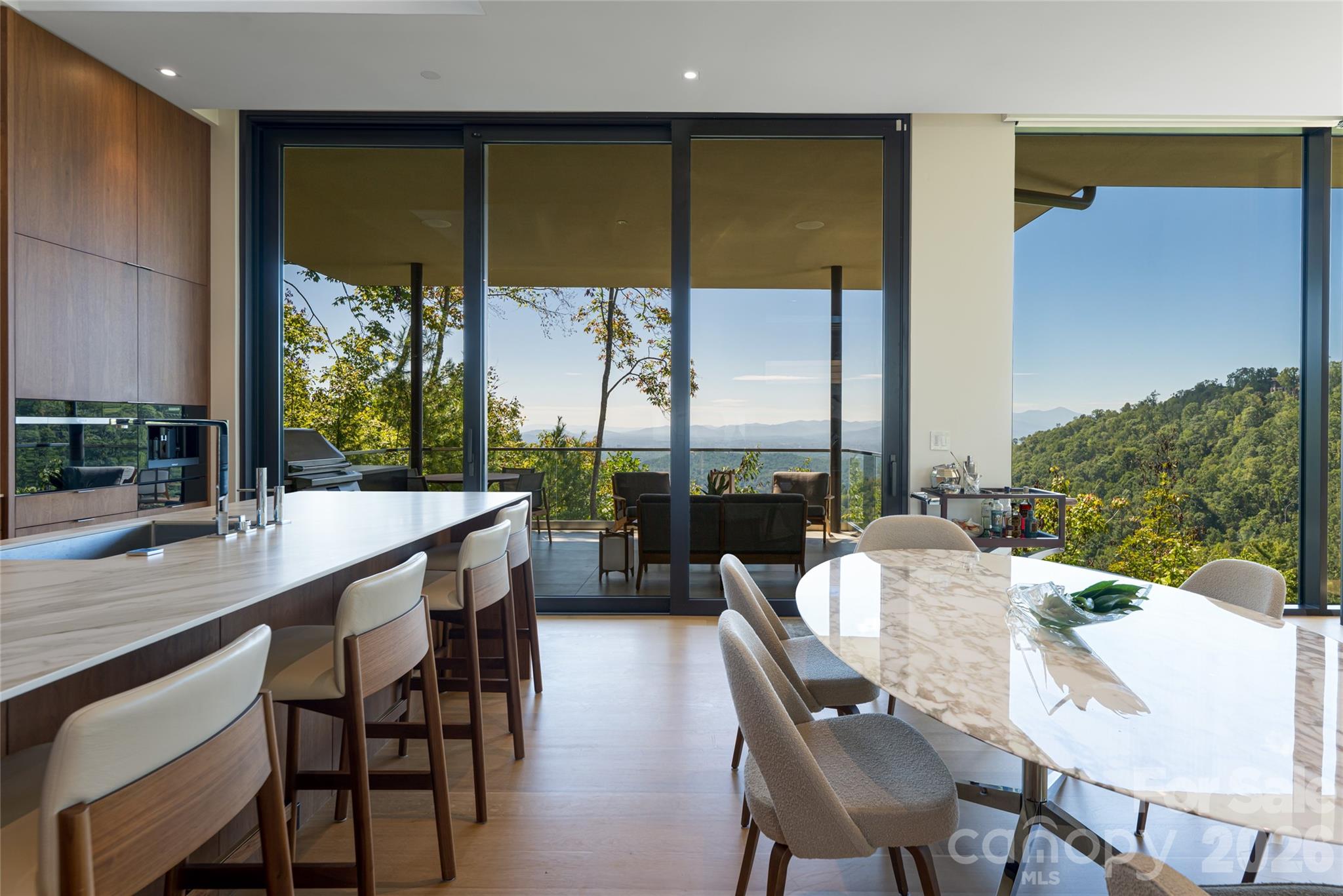 353 Retreat Ridge Way Asheville, NC 28804 - Photo 20 of 48 a dining room with furniture and a floor to ceiling window