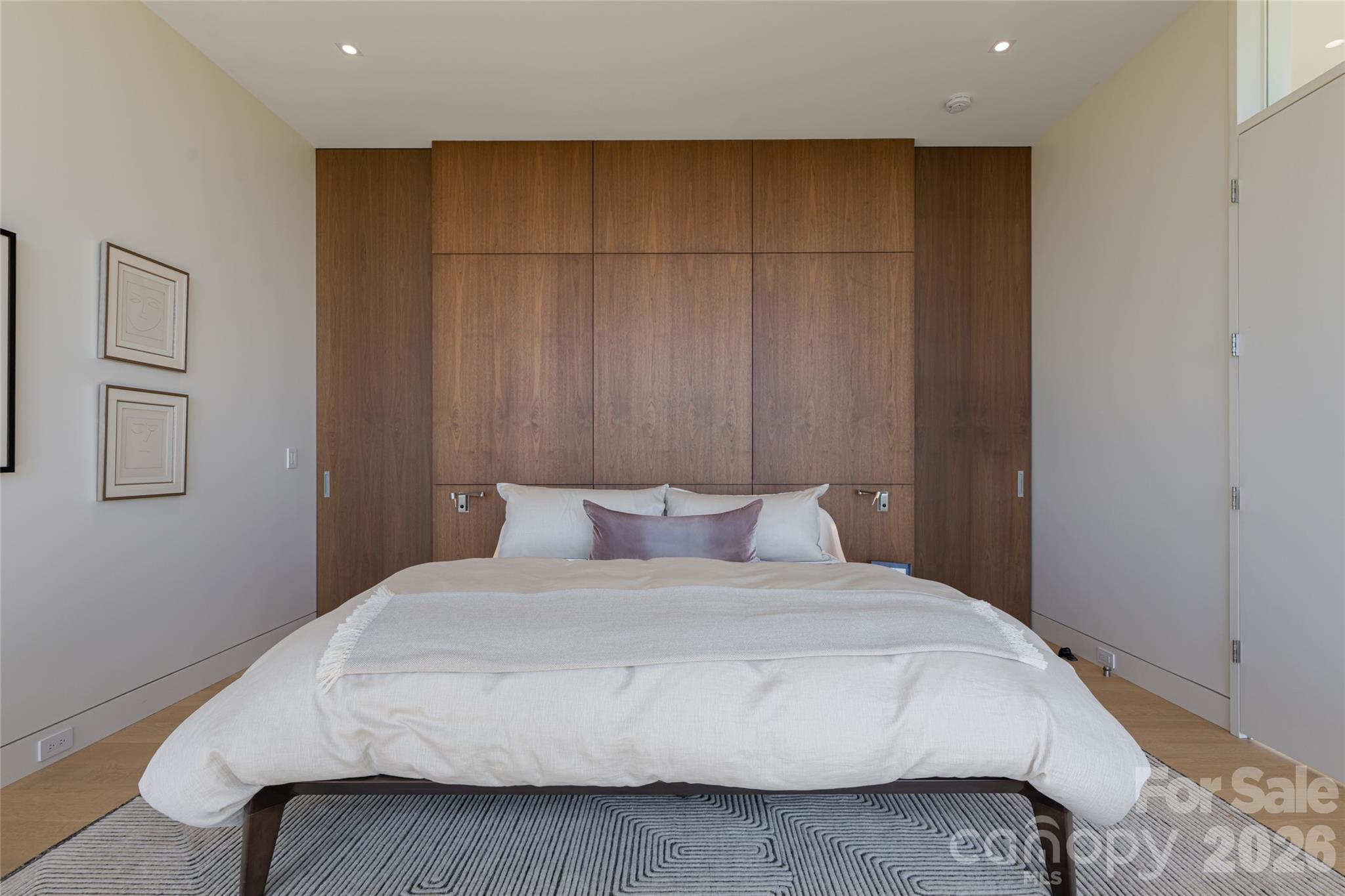 353 Retreat Ridge Way Asheville, NC 28804 - Photo 23 of 48 a bedroom with a large bed and a cabinet