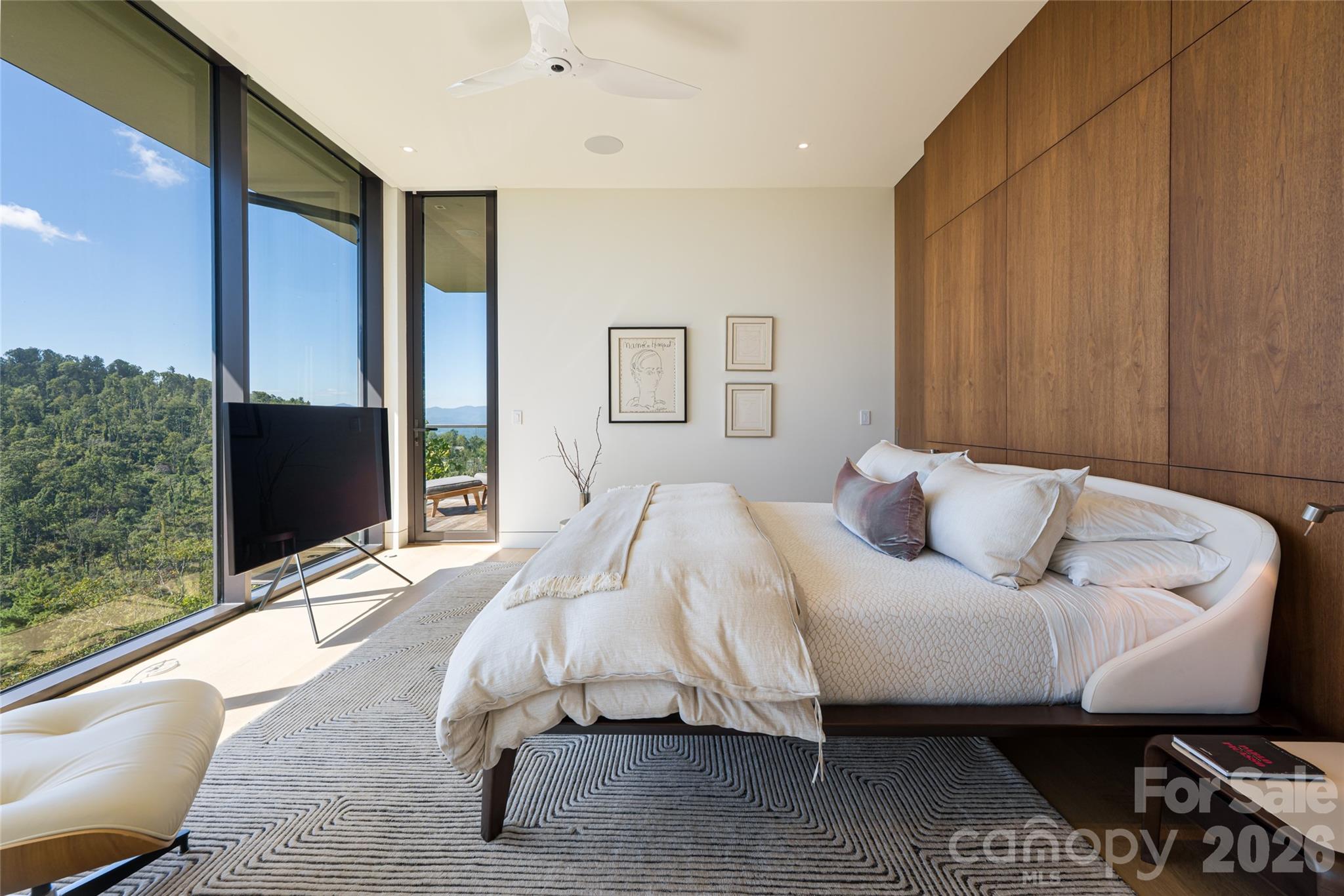 353 Retreat Ridge Way Asheville, NC 28804 - Photo 24 of 48 a bed sitting in a bedroom next to a window