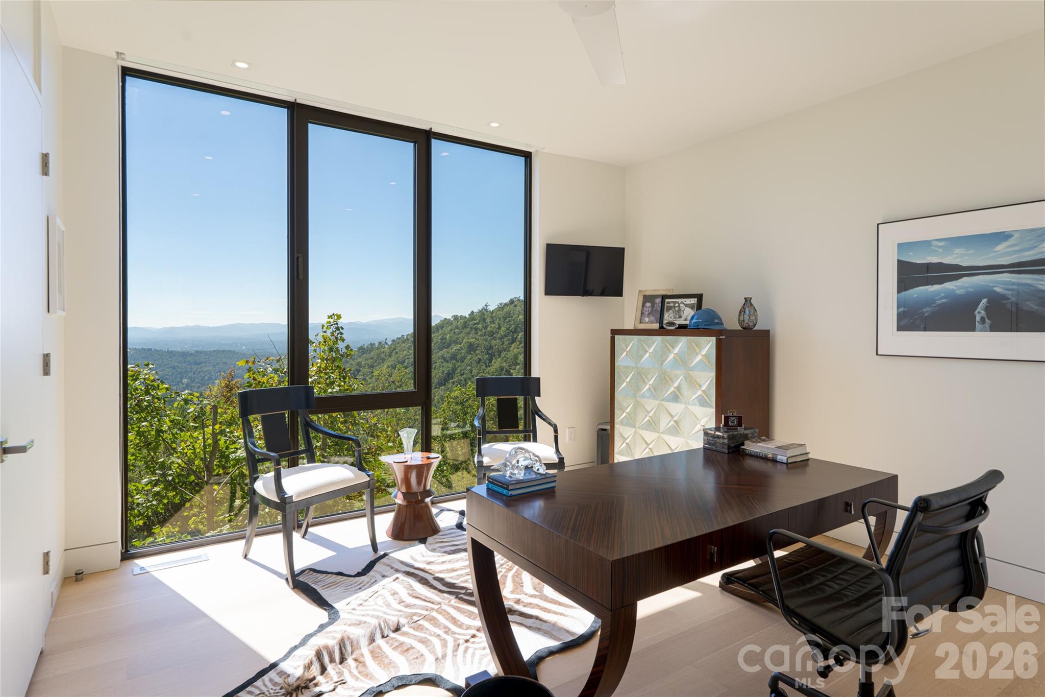 353 Retreat Ridge Way Asheville, NC 28804 - Photo 32 of 48 a view of a workspace with a table and chair in a room