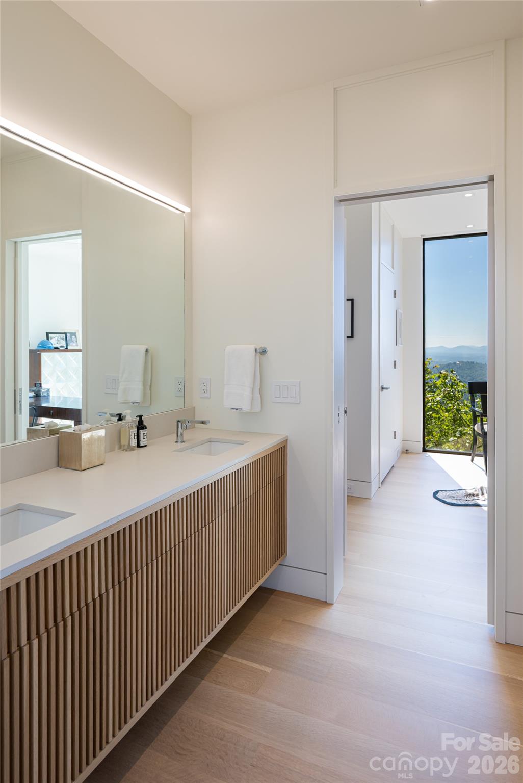 353 Retreat Ridge Way Asheville, NC 28804 - Photo 33 of 48 a bathroom with a double vanity sink and mirror