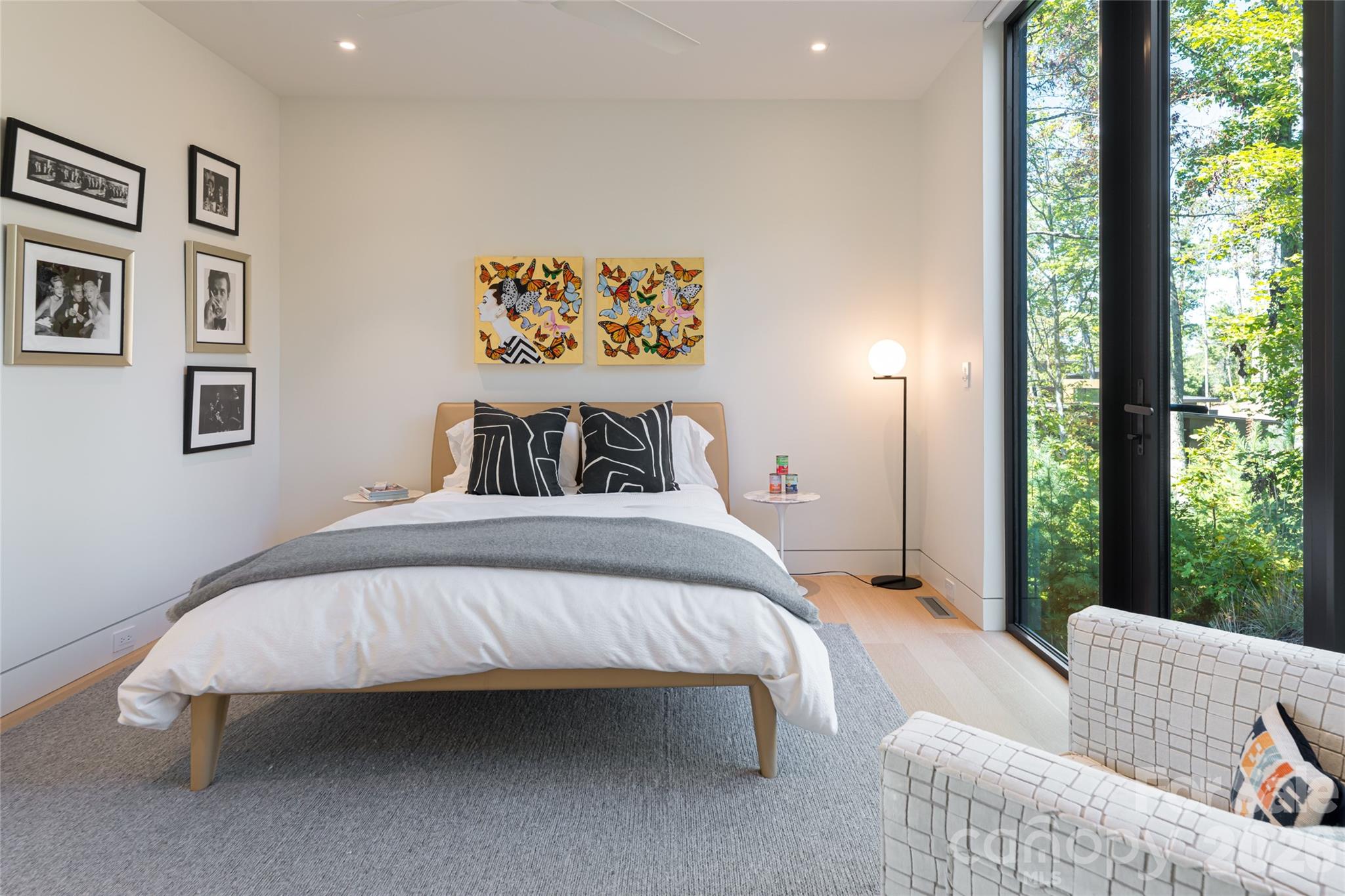 353 Retreat Ridge Way Asheville, NC 28804 - Photo 34 of 48 a bedroom with furniture and a large window