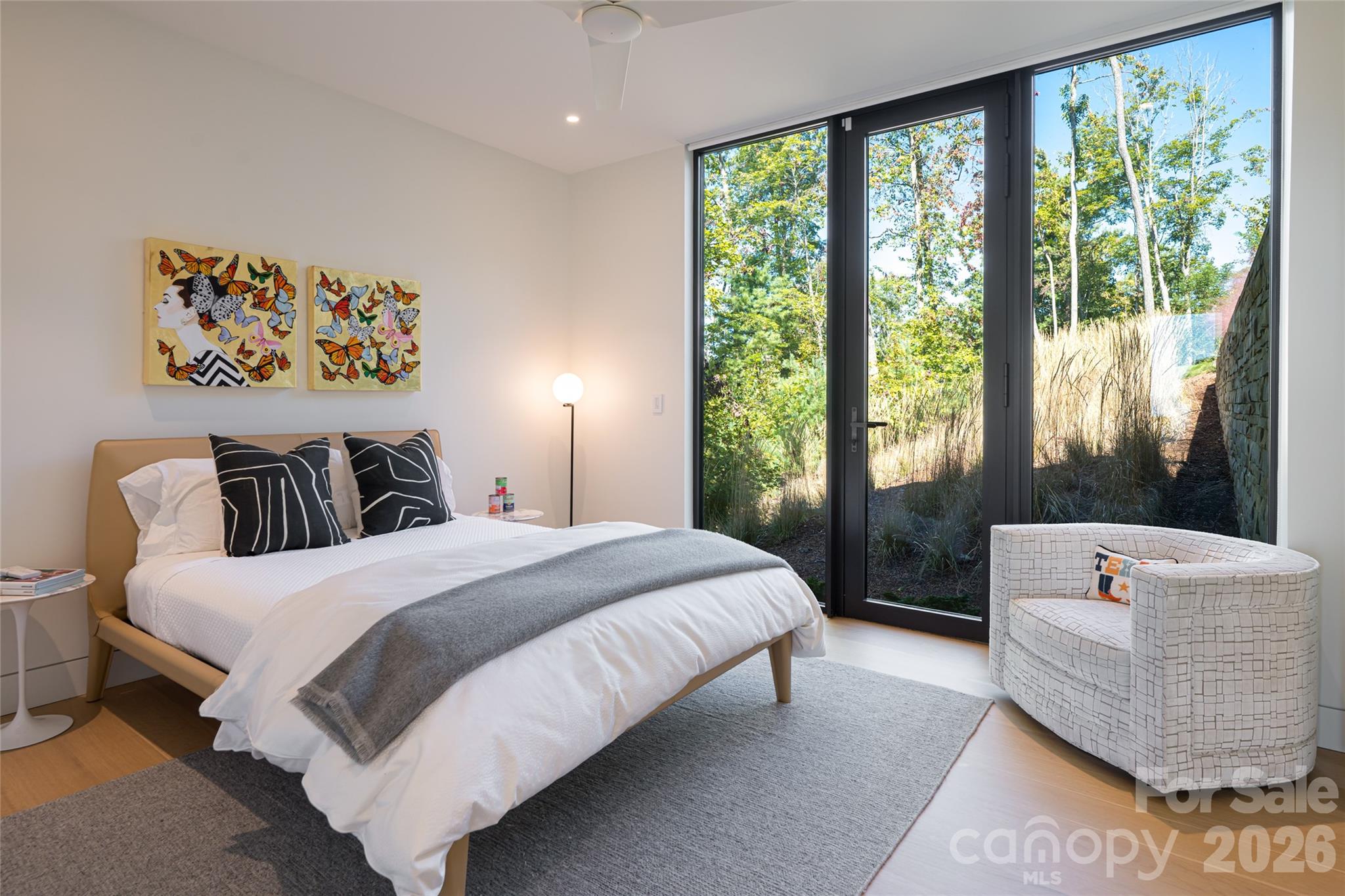 353 Retreat Ridge Way Asheville, NC 28804 - Photo 35 of 48 a bedroom with a bed and a large window
