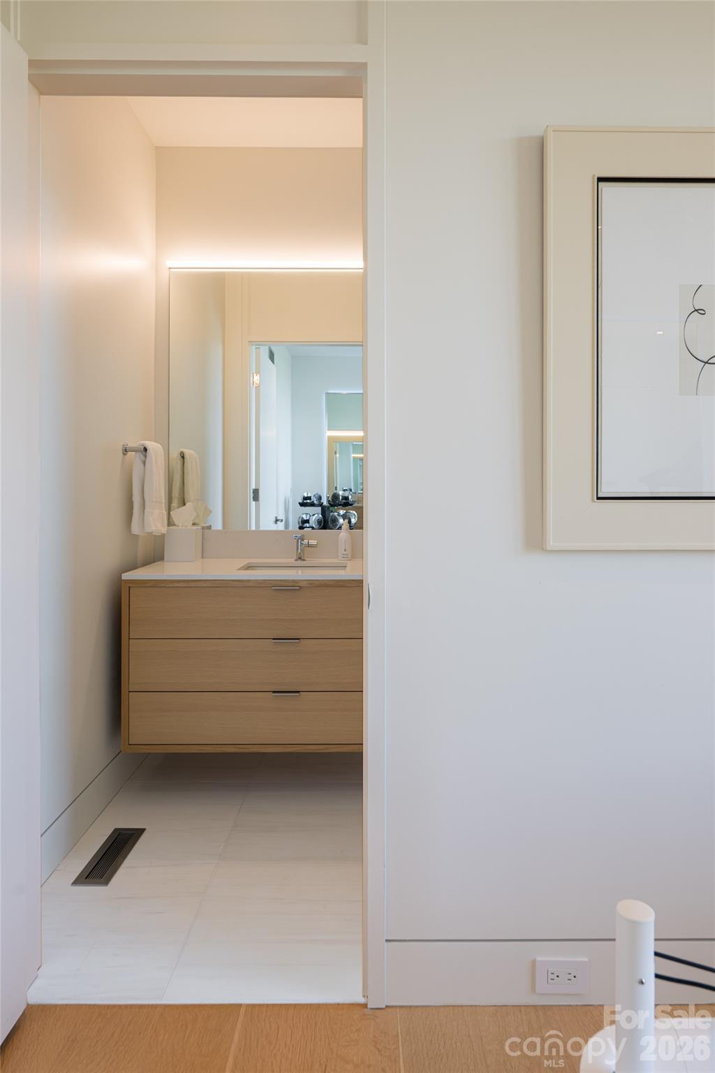 353 Retreat Ridge Way Asheville, NC 28804 - Photo 42 of 48 a bathroom with a mirror sink and vanity