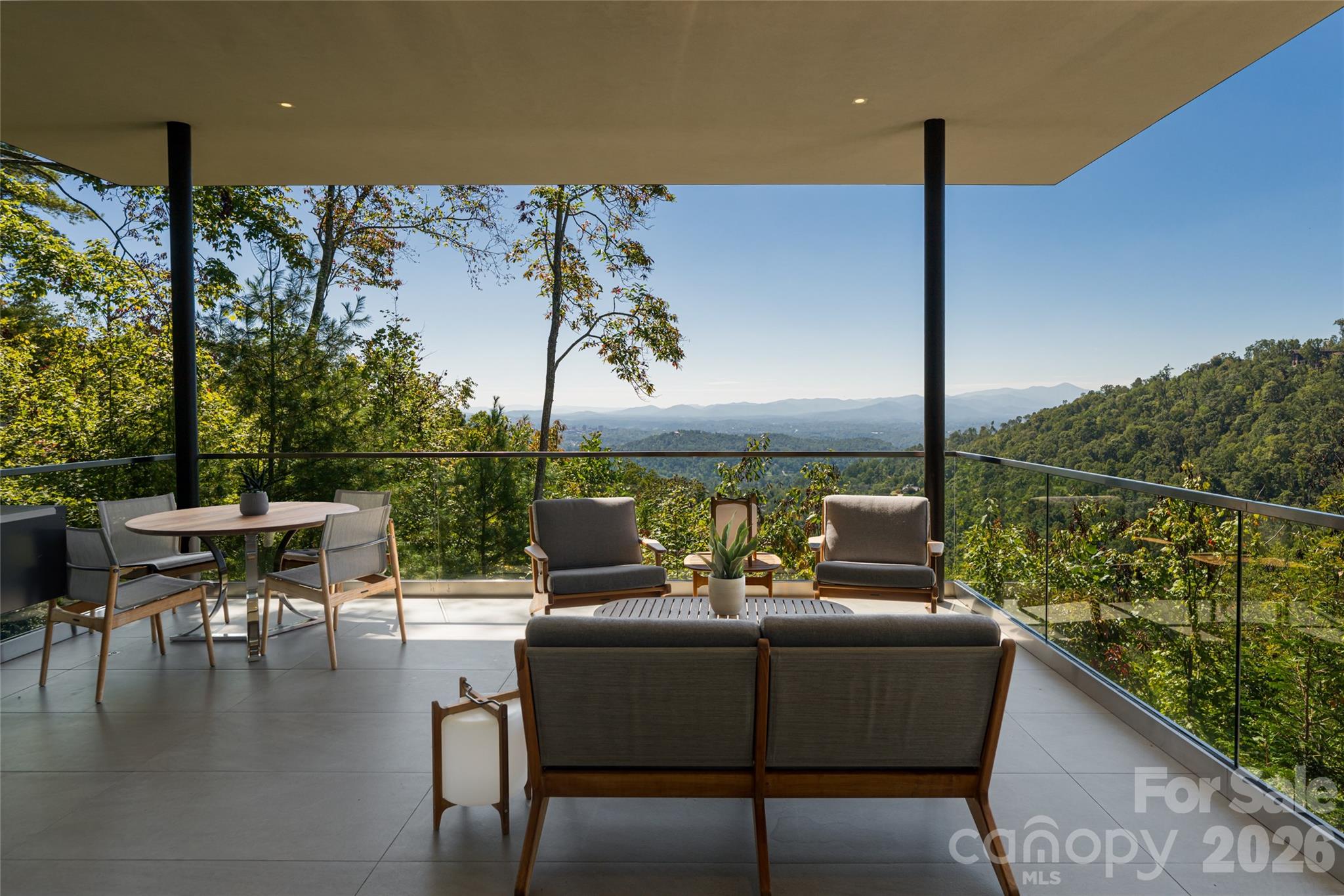 353 Retreat Ridge Way Asheville, NC 28804 - Photo 45 of 48 a roof deck with a table and chairs