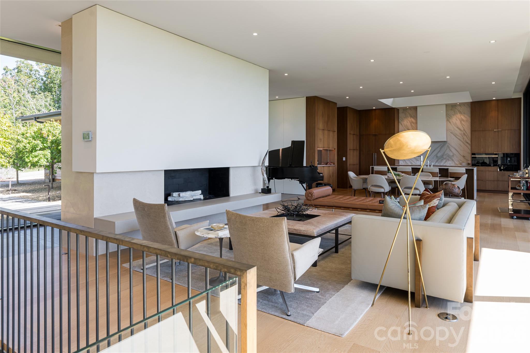 353 Retreat Ridge Way Asheville, NC 28804 - Photo 8 of 48 a living room with furniture a flat screen tv and a large window