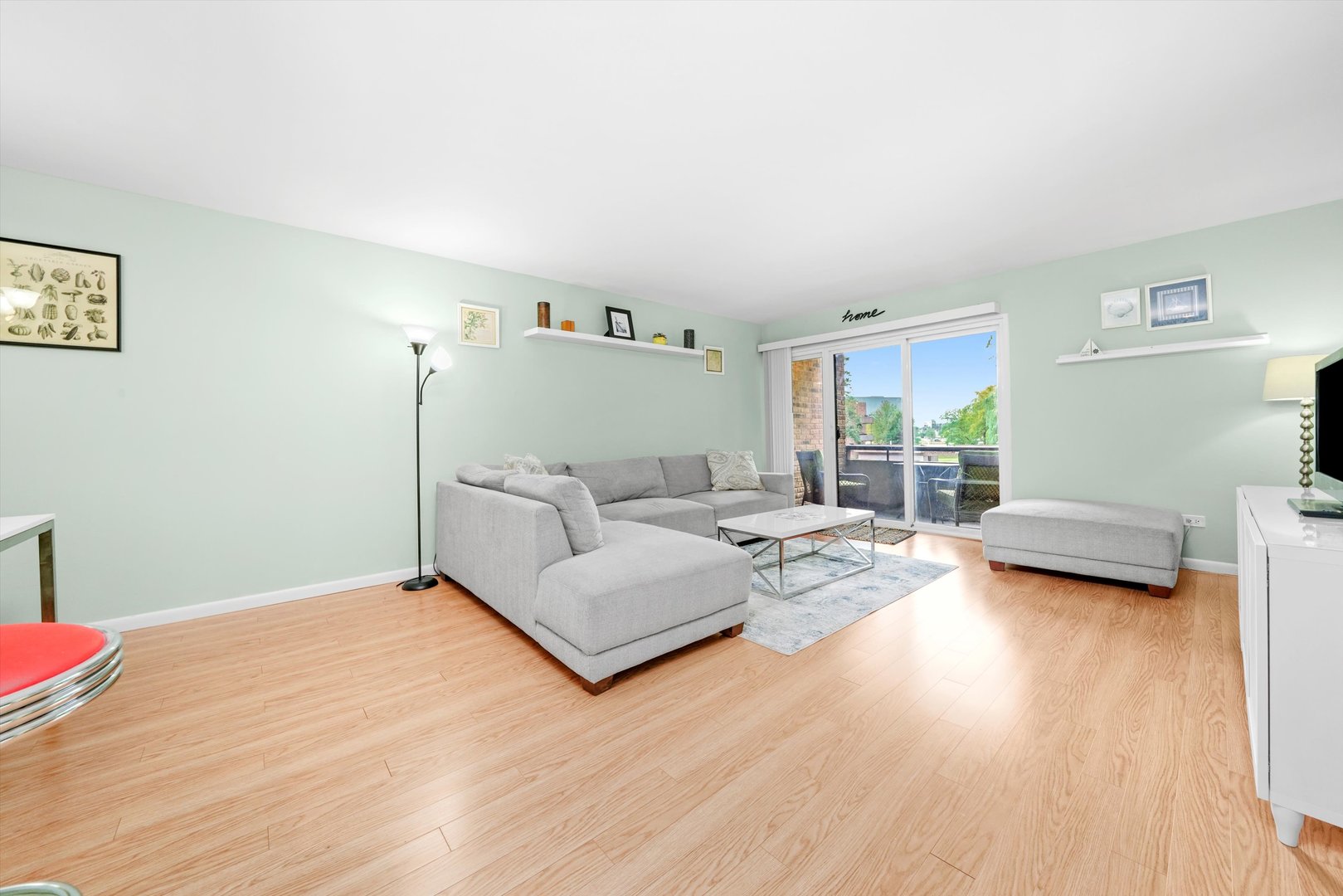 1926 Prairie Square, Unit 210B Schaumburg, IL 60173 - Photo 7 of 20 a bedroom with furniture and a wooden floor