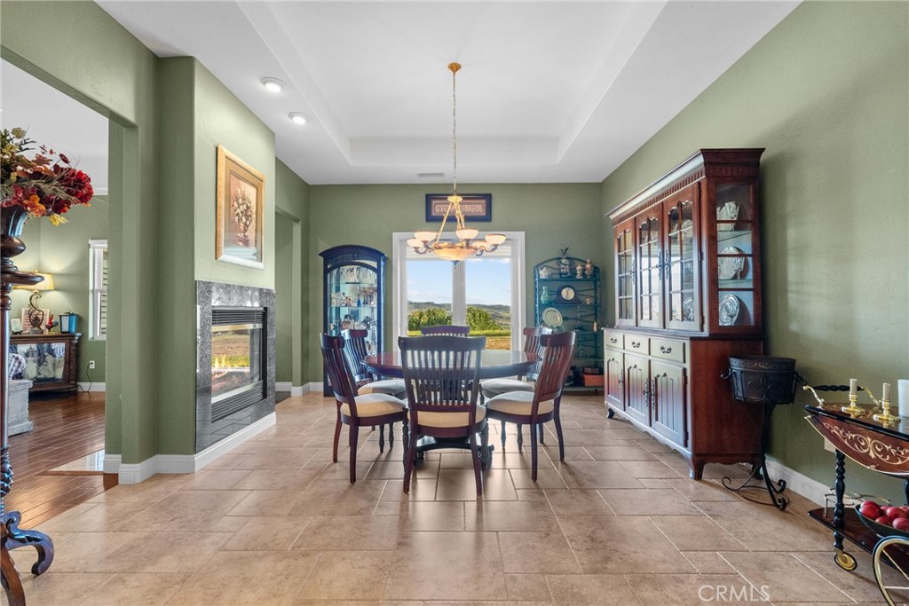 35394 Linda Rosea Road Temecula, CA 92592 - Photo 11 of 69 a dining room with furniture a chandelier and window