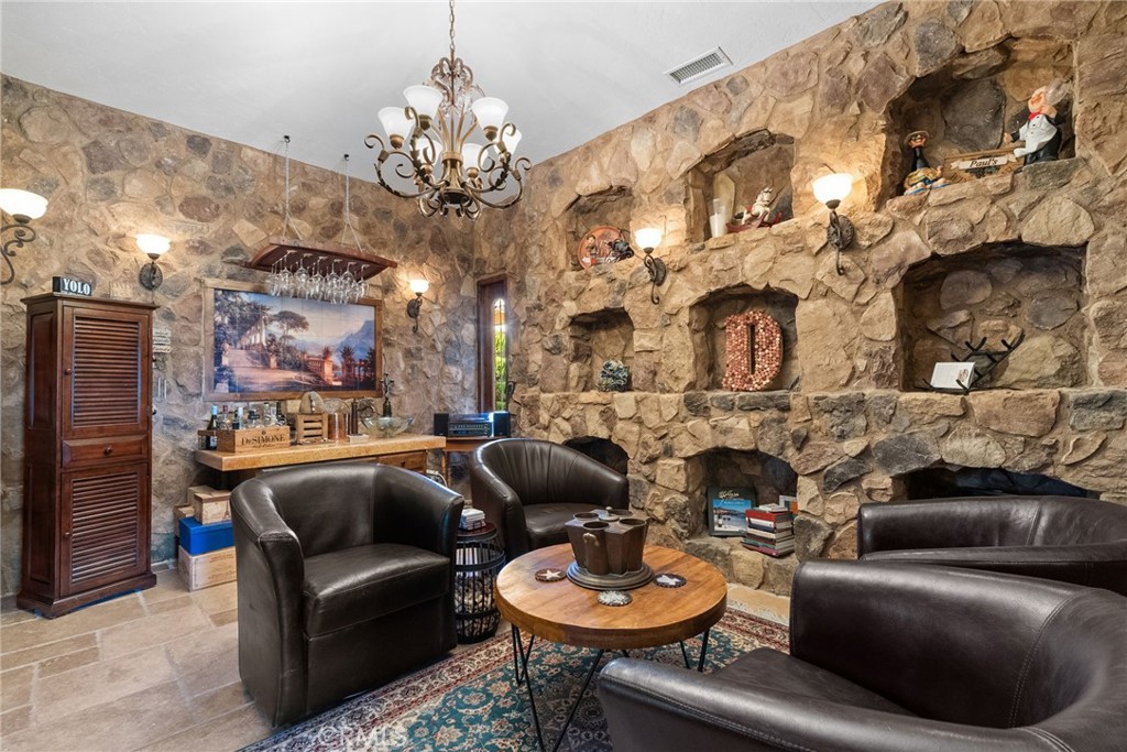 35394 Linda Rosea Road Temecula, CA 92592 - Photo 16 of 69 a living room with patio furniture and a chandelier