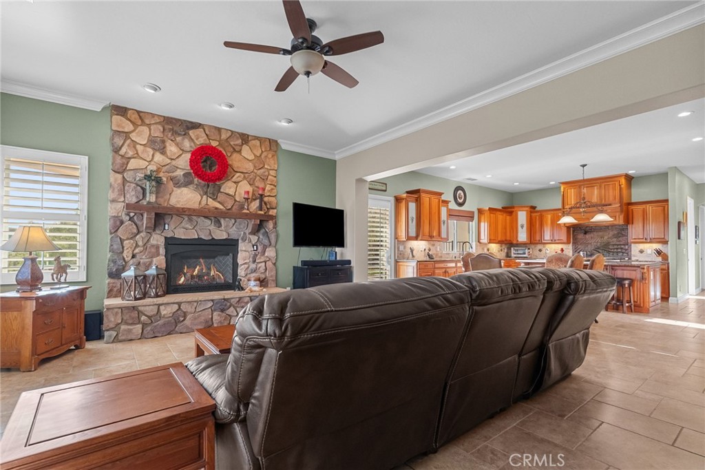 35394 Linda Rosea Road Temecula, CA 92592 - Photo 19 of 69 a living room with furniture a fireplace and a flat screen tv