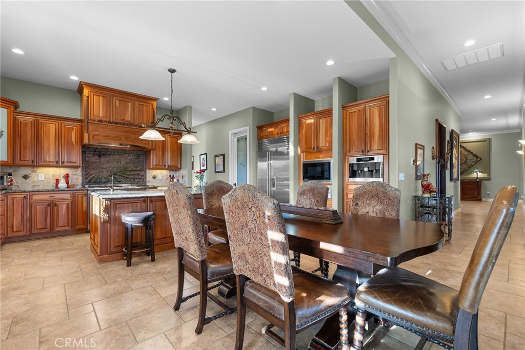 35394 Linda Rosea Road Temecula, CA 92592 - Photo 21 of 69 a dining room with furniture a window and kitchen view