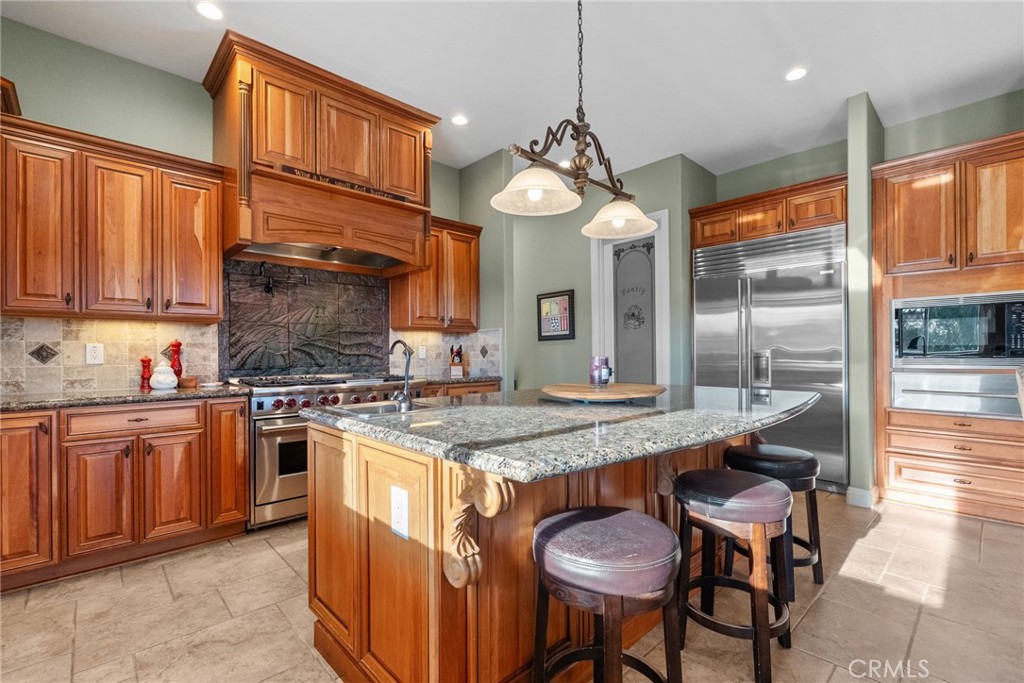 35394 Linda Rosea Road Temecula, CA 92592 - Photo 22 of 69 a kitchen with stainless steel appliances granite countertop counter space a sink and cabinets