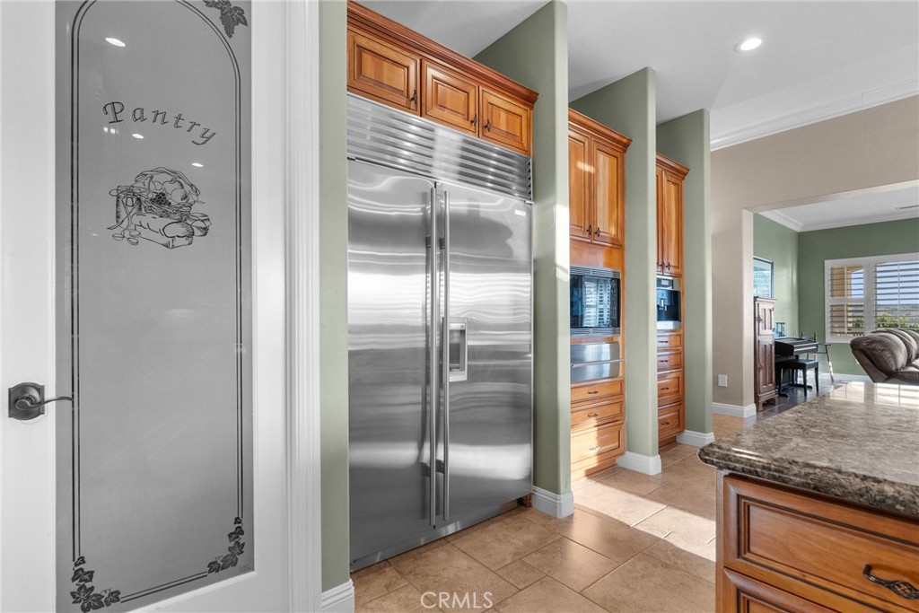35394 Linda Rosea Road Temecula, CA 92592 - Photo 25 of 69 a kitchen with granite countertop a refrigerator and a sink