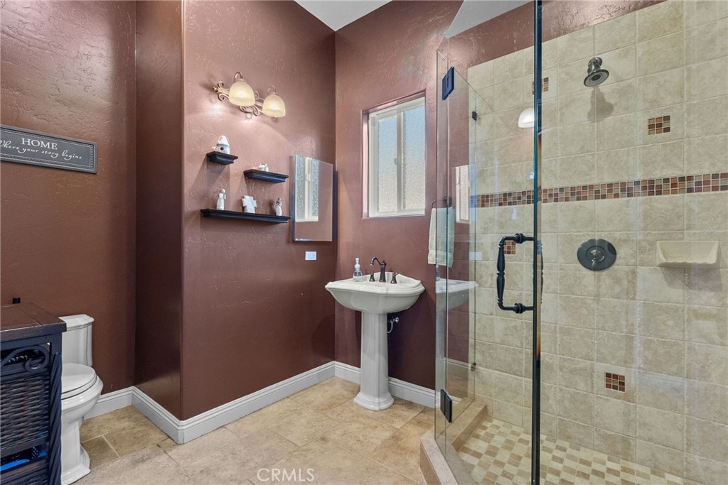 35394 Linda Rosea Road Temecula, CA 92592 - Photo 30 of 69 a bathroom with a sink toilet and shower