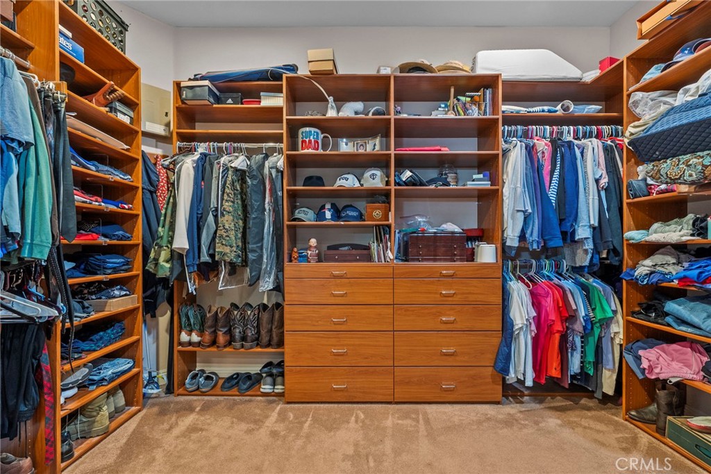 35394 Linda Rosea Road Temecula, CA 92592 - Photo 38 of 69 a view of walk in closet with clothes and shoes