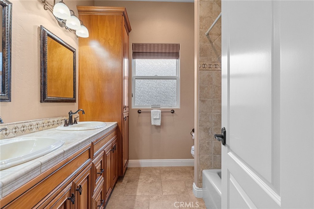 35394 Linda Rosea Road Temecula, CA 92592 - Photo 39 of 69 a bathroom with a sink a toilet and shower