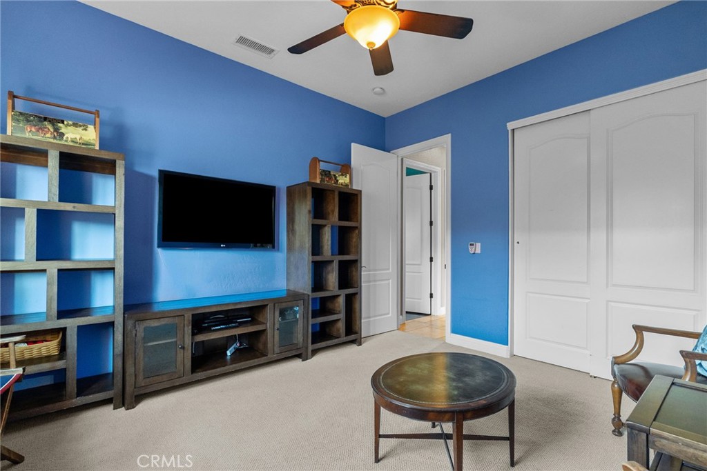 35394 Linda Rosea Road Temecula, CA 92592 - Photo 46 of 69 a living room with furniture and a flat screen tv