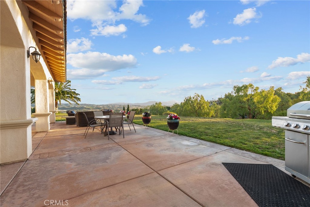 35394 Linda Rosea Road Temecula, CA 92592 - Photo 50 of 69 a view of a patio with a table and chairs