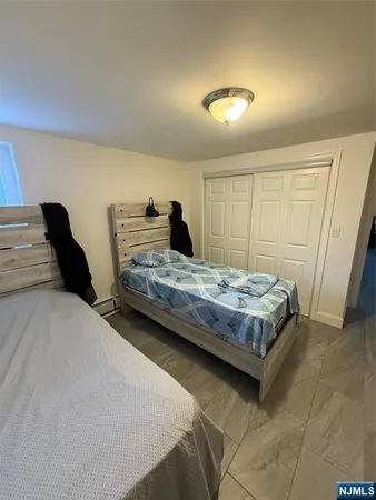 a bedroom with a bed and a walk in closet