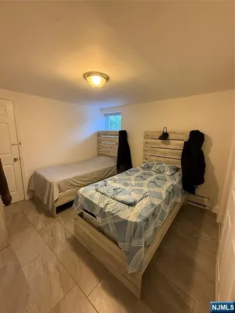 a bedroom with bed and window