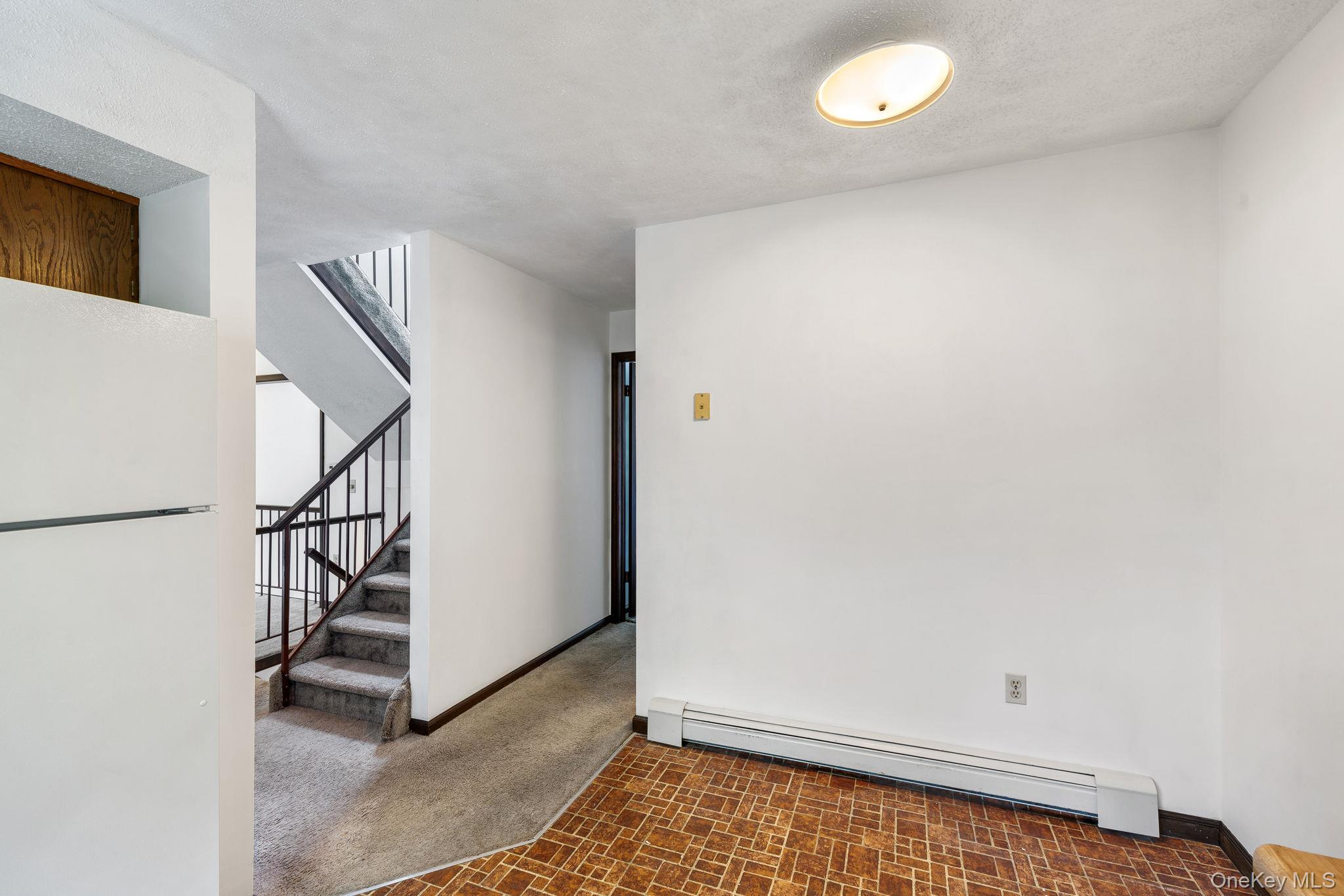 9 Spruce Court Fishkill, NY 12524 - Photo 13 of 33 a view of an empty room with stairs