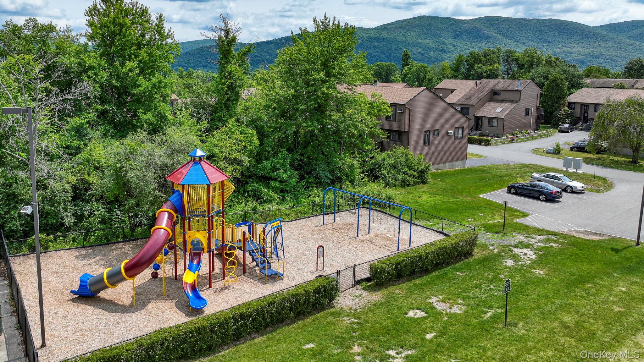 9 Spruce Court Fishkill, NY 12524 - Photo 28 of 33 an aerial view of a house with swimming pool and garden
