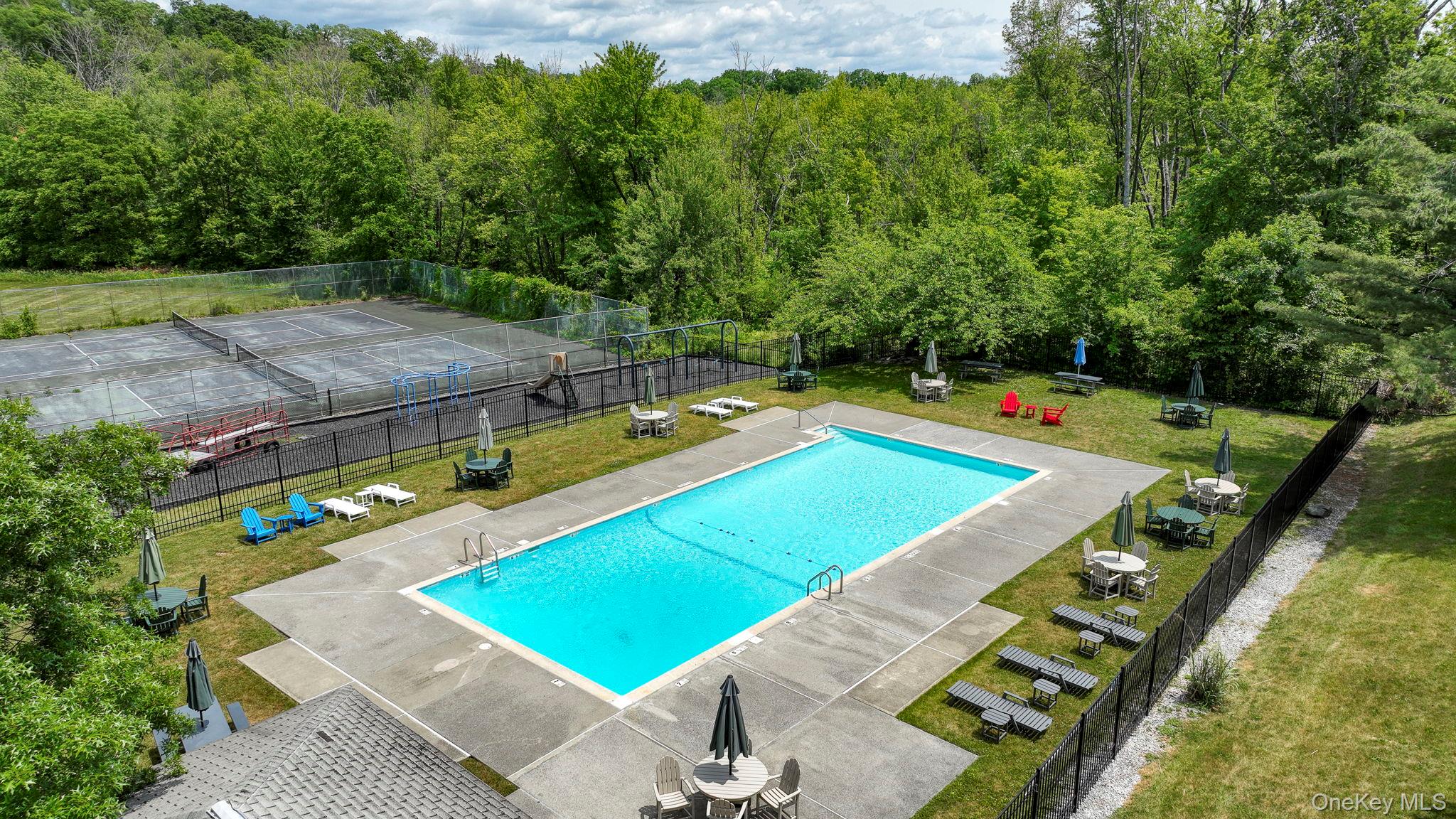 9 Spruce Court Fishkill, NY 12524 - Photo 29 of 33 swimming pool with chairs and yard