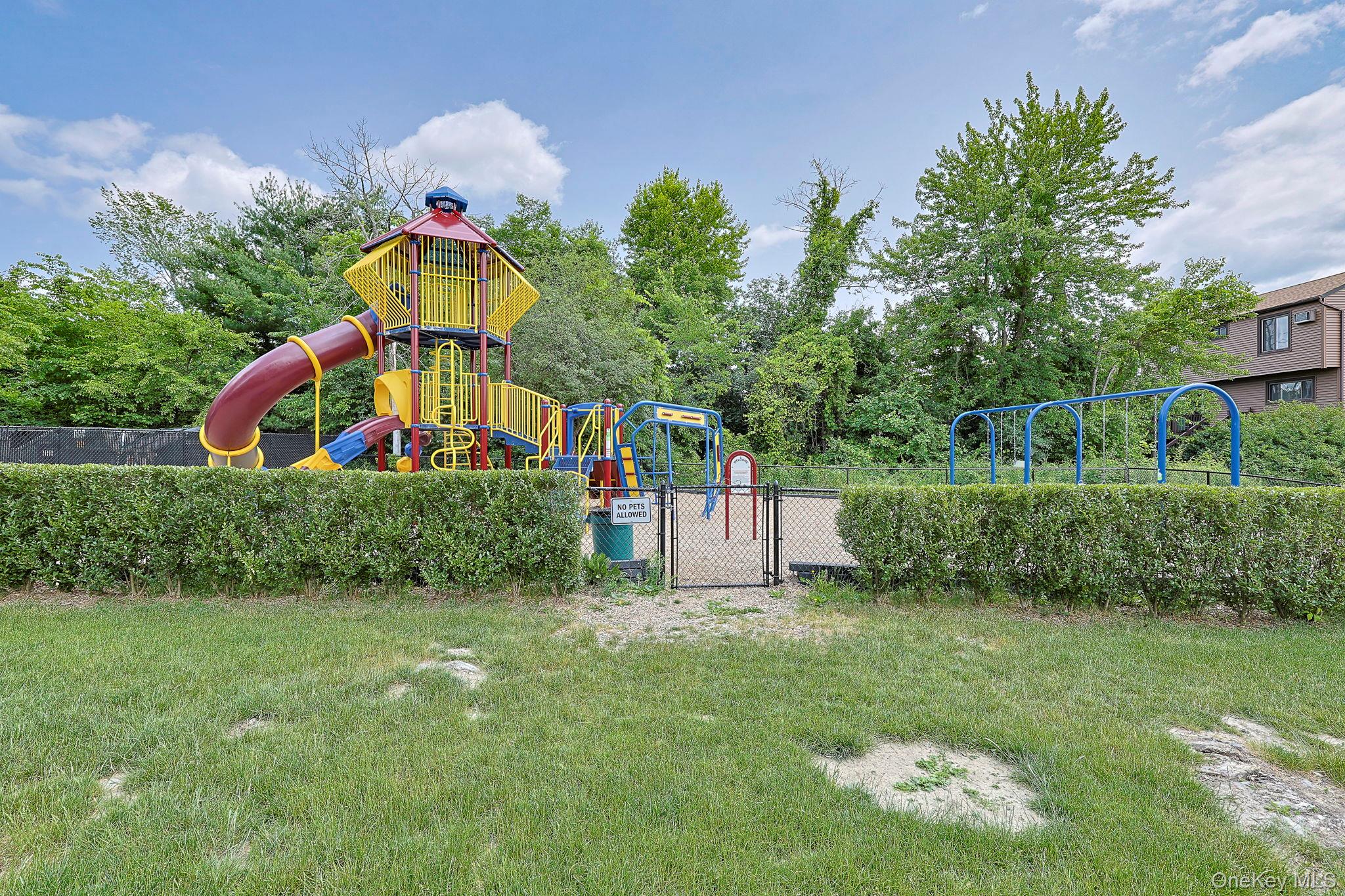 9 Spruce Court Fishkill, NY 12524 - Photo 33 of 33 a front view of small house with a yard garden and outdoor seating
