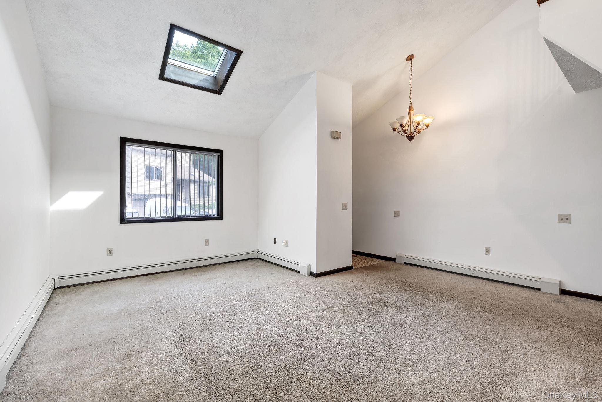 9 Spruce Court Fishkill, NY 12524 - Photo 5 of 33 an empty room with windows and closet