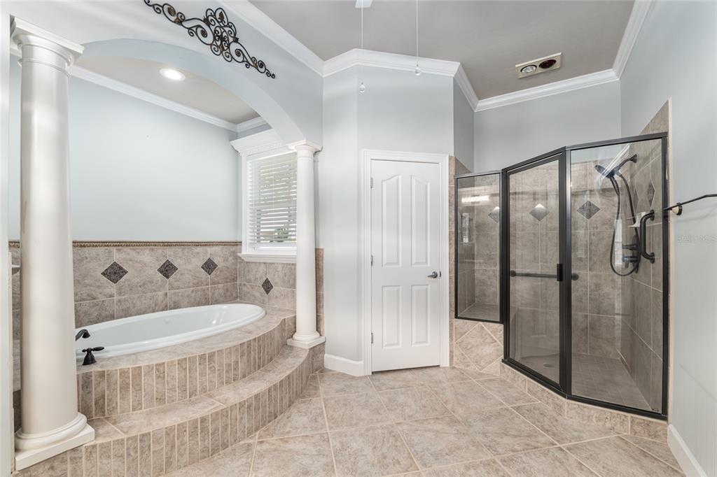 10614 Southwest 15th Lane Gainesville, FL 32607 - Photo 37 of 85 a bathroom with a bathtub and a shower
