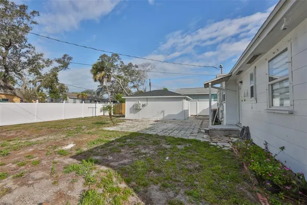 a view of a house with a yard and garage